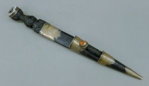 A Scottish silver mounted dirk, engraved with a crest. 44 cm long overall.