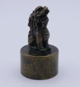 A bronze dog-of-fo seal. 7 cm high.