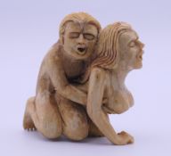 An erotic carving. 6.5 cm high.