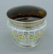An enamel painted glass dressing pot, with silver and tortoiseshell lid. 8.5 cm high.