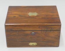 A 19th century rosewood travelling box with silver-plated fittings. 31.5 cm wide.