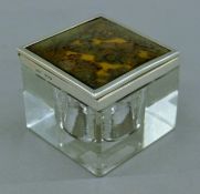 A silver and tortoiseshell mounted inkwell. 6 cm high.