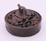 A bronze censer. 7.5 cm diameter.