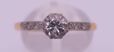 An 18 ct gold cubic zirconia ring. Ring size S/T. 1.8 grammes total weight.