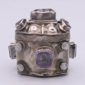 A Dutch silver pill box inset with stones. 4.5 cm high.
