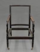 A Regency Period mahogany bergere framed easy chair on turned legs. 65 cm wide.
