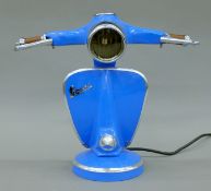 A blue 'Vespa' table lamp. 34 cm high.