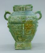 A Chinese Archaic-style green stone vase. 21 cm high.