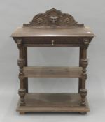 A Victorian carved oak buffet. 99 cm wide.