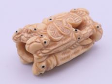 An insect-form bone carving. 5 cm long.