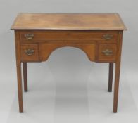 A 19th century mahogany three-drawer side table. 91 cm wide.