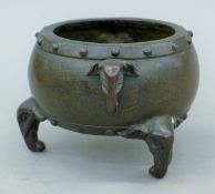 A Chinese bronze elephant-handled censer. 16 cm wide.