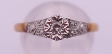 An 18 ct gold and platinum illusion set diamond ring. Ring size R 3 grammes total weight.