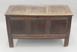 An 18th century oak three-panelled coffer. 120 cm wide.