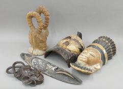 A quantity of African tribal masks, including a Chiwara example. The largest 58 cm high.