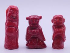 Three carved coral figures. Tallest 6 cm high.