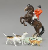 A Beswick porcelain rearing horse and huntsman,