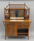 A Victorian Art Nouveau walnut mirror-back sideboard. 137 cm wide x 190 cm high.