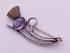 A silver thistle brooch. 5 cm high.