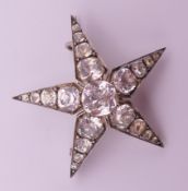 A star form brooch. 4 cm diameter.