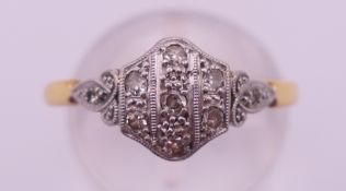 An Art Deco 18 ct gold and diamond ring. Ring size Q/R. 2.7 grammes total weight.