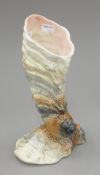 A shell-form pottery vase. 25 cm high.