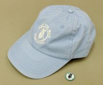 A Stop the War Coalition baseball cap and a small Stop the War pin badge.