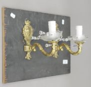 A pair of gilt and cut glass wall lights mounted on a board. Each 18.5 cm high.