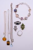 A quantity of silver jewellery including pendant necklaces, pendants, a ring,