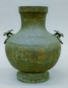 A Chinese bronze vase with ruyi sceptre handles. 27.5 cm high.