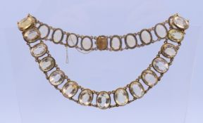 A graduated citrine collet necklace. Necklace 39 cm long, central stone 2 cm high.