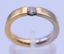 An 18 ct gold diamond solitaire ring. Ring size M. 8.1 grammes total weight.