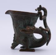 A bronze jue cup. 8 cm high.