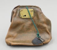 A vintage National Westminster Bank brass-mounted leather cash bag. 16 cm high.