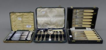 A cased set of silver-handled knives and two cases of plated cutlery. The former case 20 cm wide.