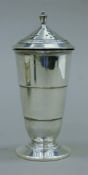 An Art Deco silver-clad sugar castor. 17.5 cm high.