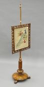 A 19th century rosewood tapestry-inset pole screen. 141 cm high.