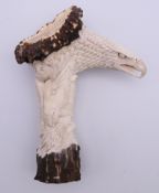 A stag antler walking stick handle carved with eagles and other animals. 14.5 cm high.