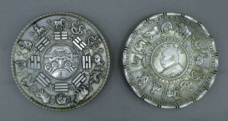 Two Chinese white metal coin dishes. Each 10 cm diameter.