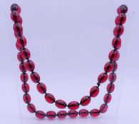 A bead necklace. Approximately 80 cm long, beads approximately 1.5 cm long.
