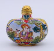 A canton enamel snuff bottle and stopper. 5 cm high.