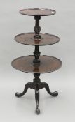 A 19th century mahogany three-tier dumb waiter. 113 cm high.