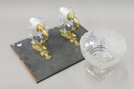 A pair of gilt and cut glass wall lights mounted on a board and a cut glass pedestal bowl.