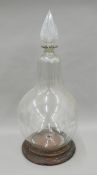 A 19th century clear glass carboy on stand. 86 cm high overall.