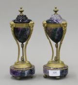 A pair of gilt metal-mounted fluorite cassolettes. Each 24 cm high.