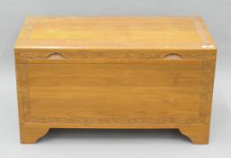 A carved camphor wood chest. 100 cm wide.