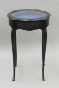 A Victorian ebonized bijouterie table. 48 cm diameter.