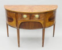 A George III mahogany demi-line sideboard. 129 cm wide.
