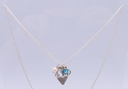 A Kerry Richardson silver art jewellery pendant necklace. Necklace 60 cm long, pendant 2.5 cm high.