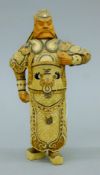A Japanese carved wood and straw work figure. 22 cm high.